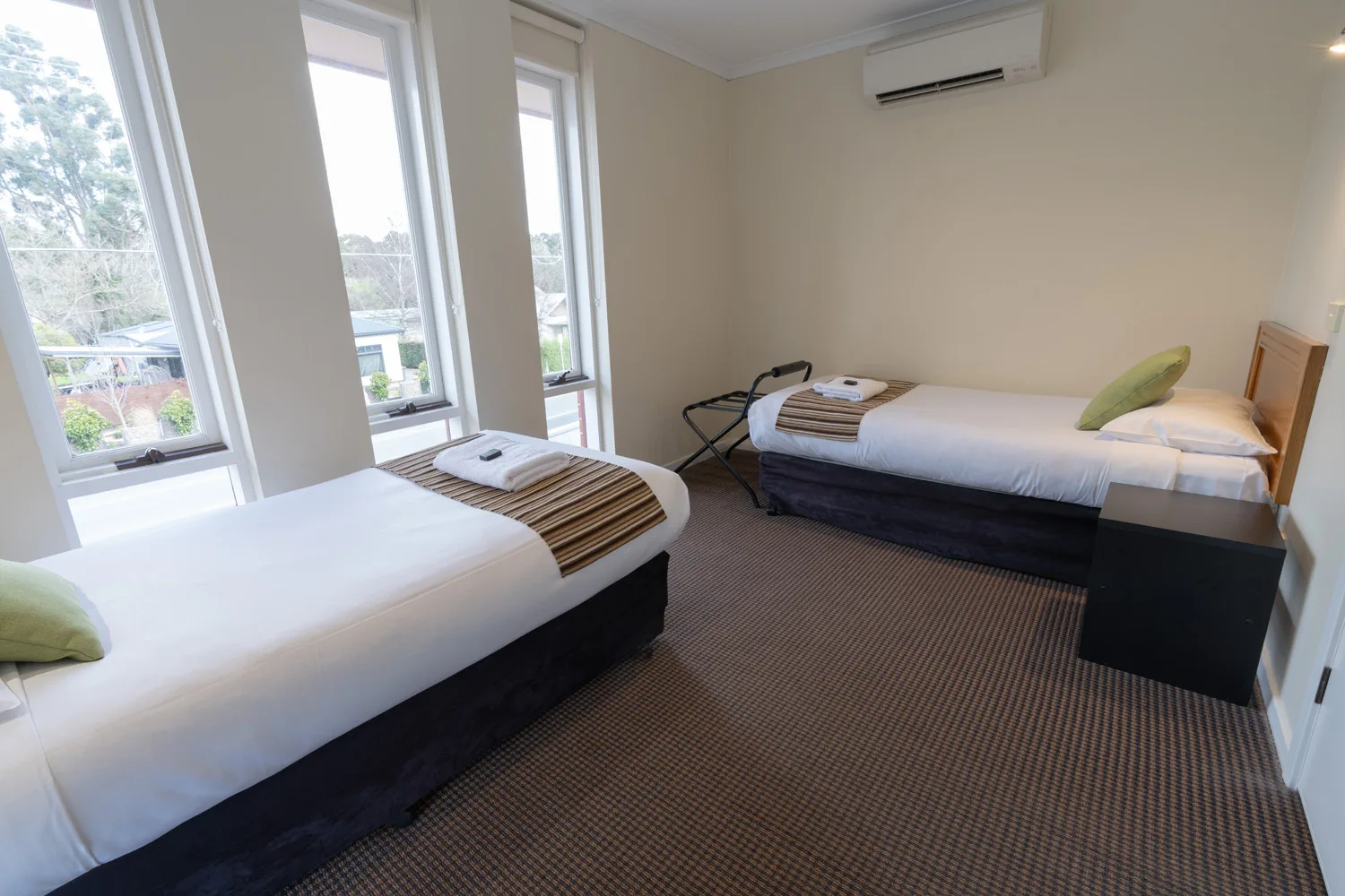 Twin bedroom in an apartment at Sovereign Park Motor Inn.